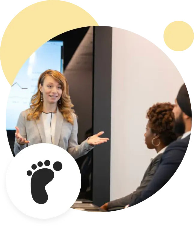 Woman presenting to coworkers.
