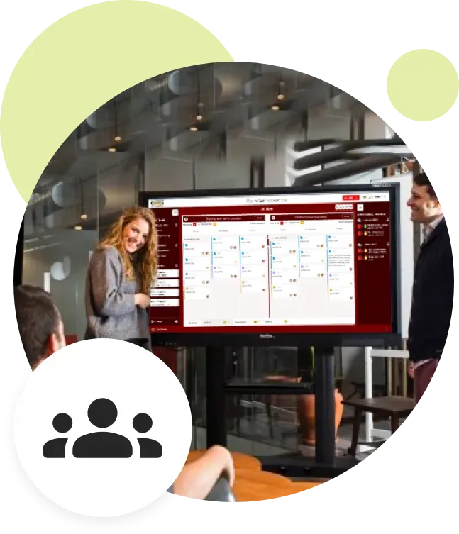 Woman presenting to coworkers.