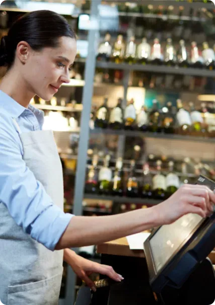 Waitress using POS system.
