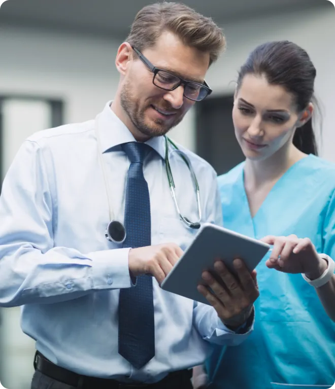 Doctor reviewing data on a tablet.