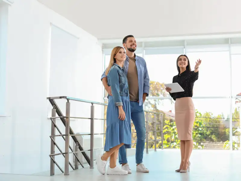 people looking at a house to buy