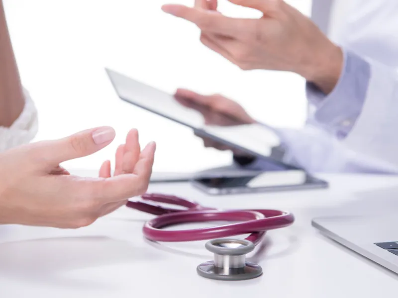 A doctor talking with a patient.