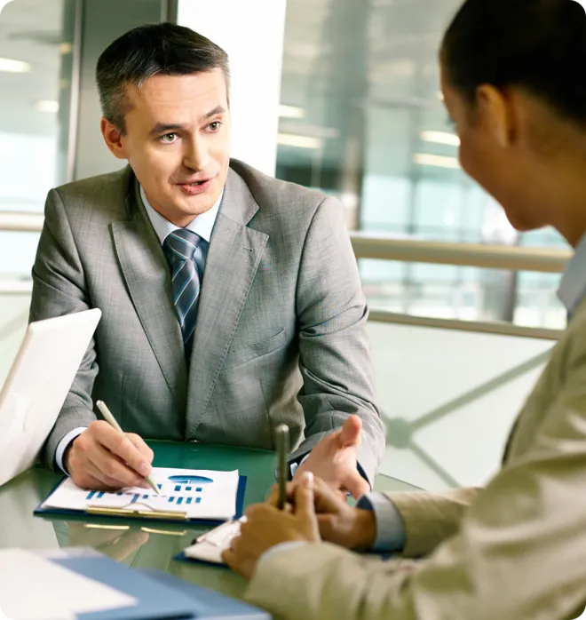 Man presenting data to a woman.