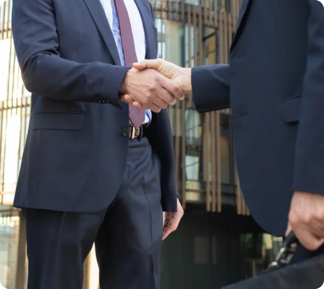 Two businessmen shaking hands.