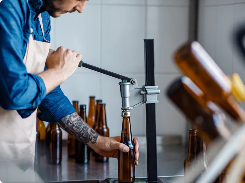 A brewer bottling beer.