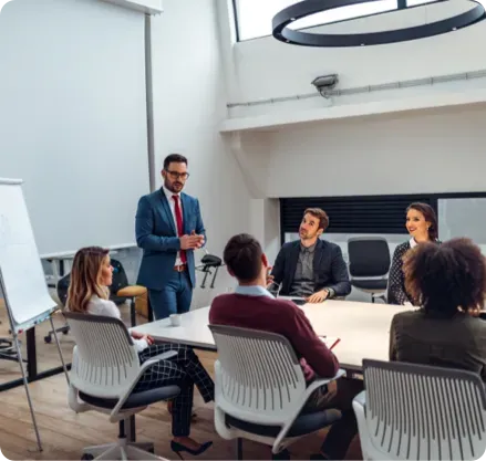Business man presenting in front of coworkers.